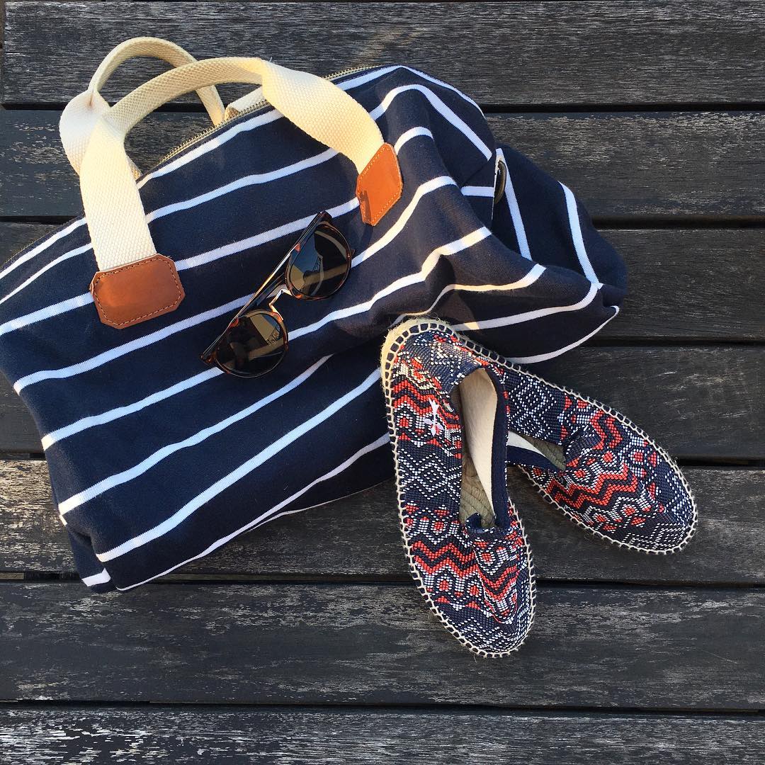 Stripped Bag with colorful shoes and sunglasses