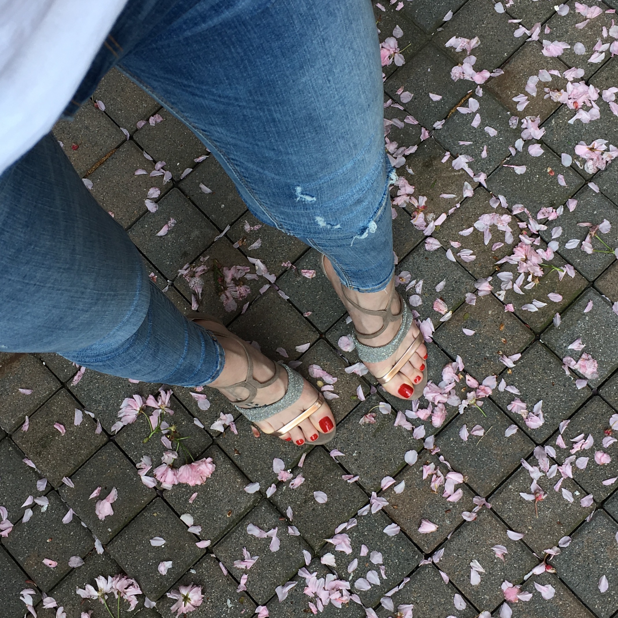 strappy heels on cobble floor