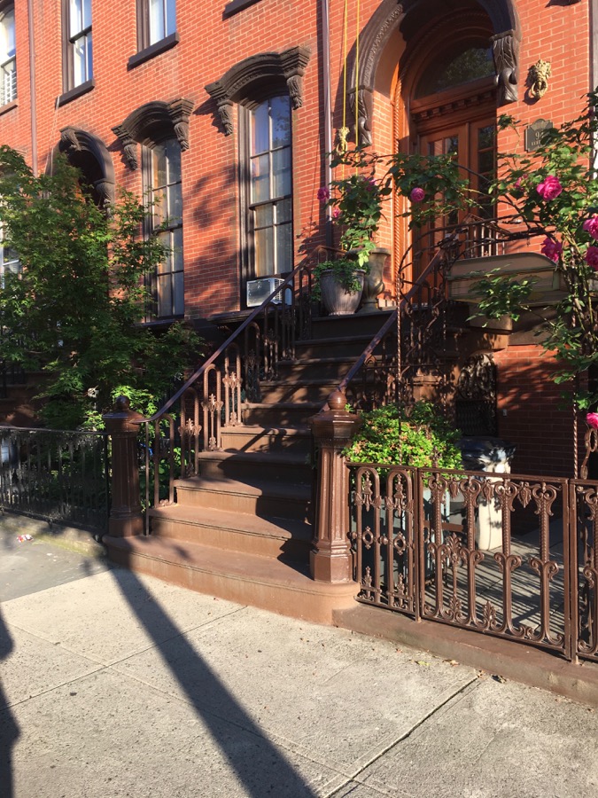 Brownstone in Brooklyn with colorful flowers