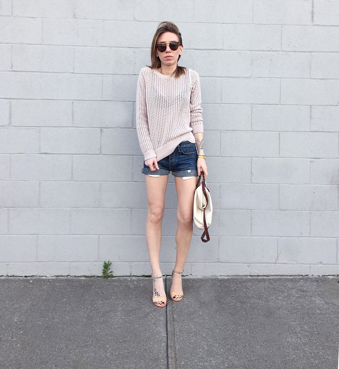 Pink sweater with denim shorts and heels outfit