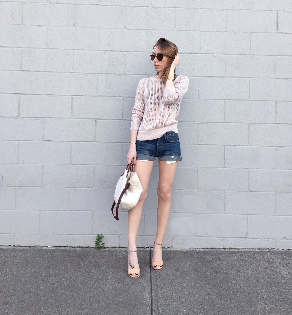 Pink sweater with denim shorts outfit