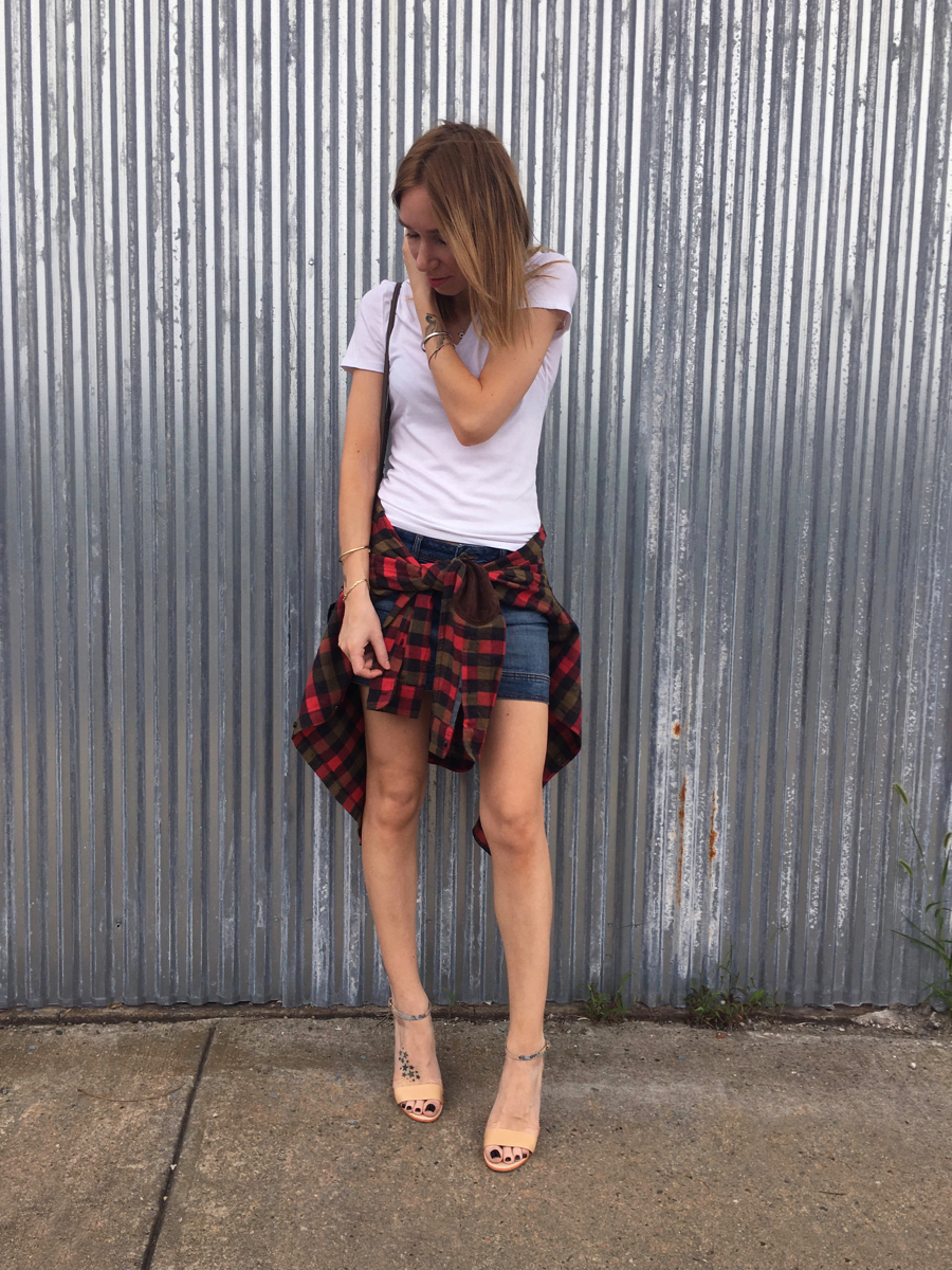 White tee with a denim skirt and a red flannel outfit