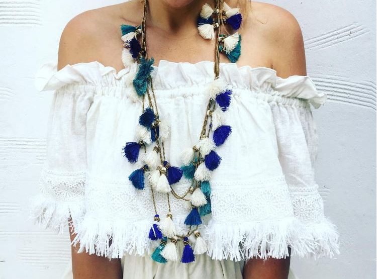 White tassel top with blue and green tassel necklace
