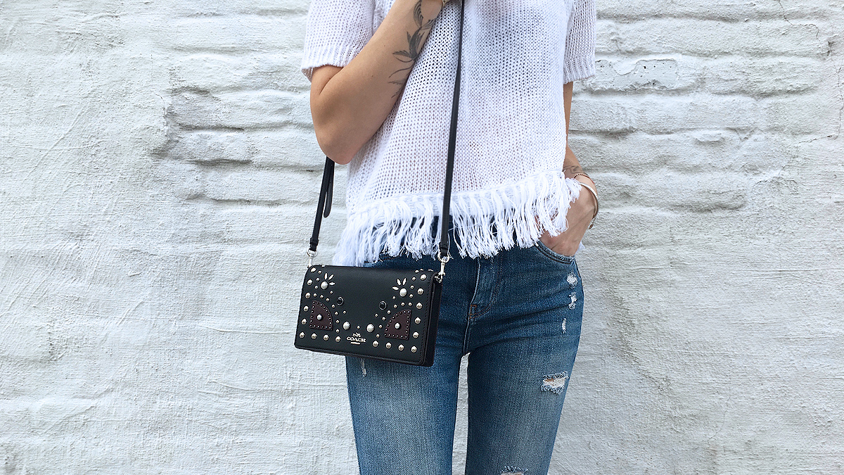 White fringe top with denim zoomed in detail