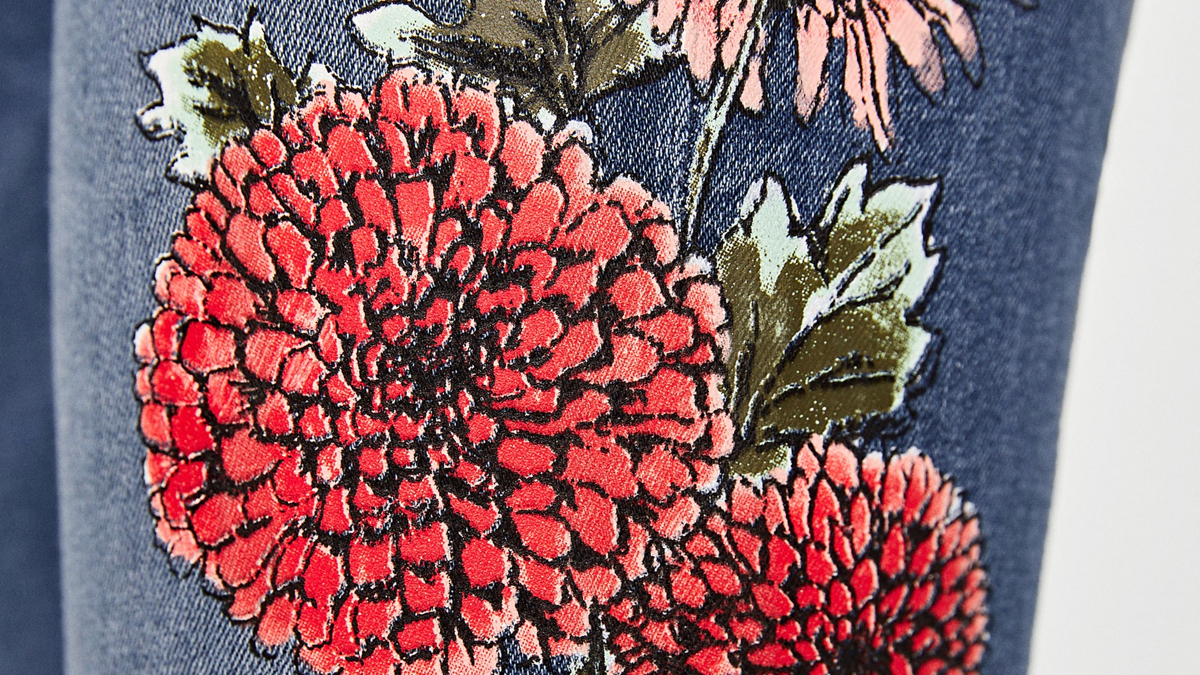 Zara jeans with multi colored embroidery zoomed in detail