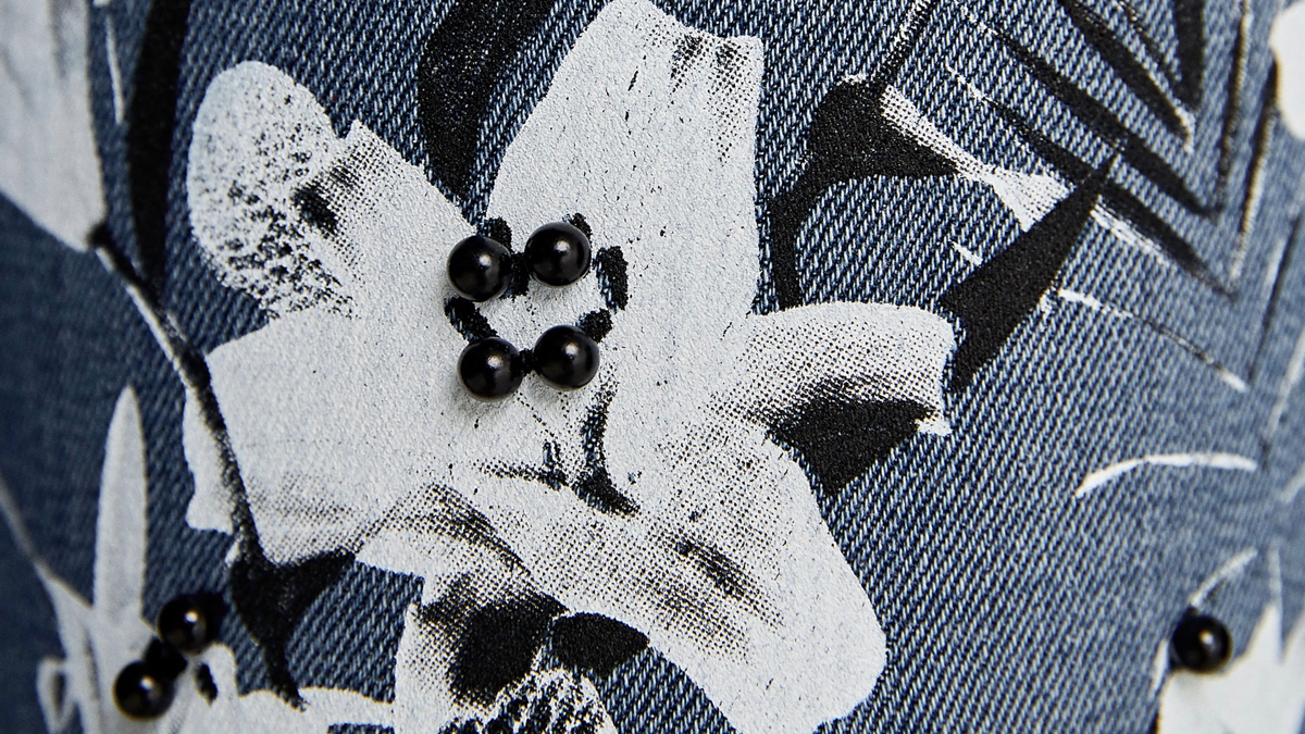 Denim jeans with painted flowers and beads