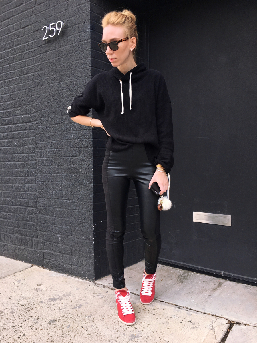 Woman posing wearing all black outfit