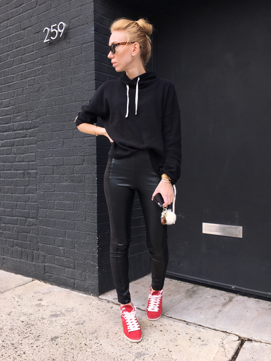 Woman posing in all black outfit
