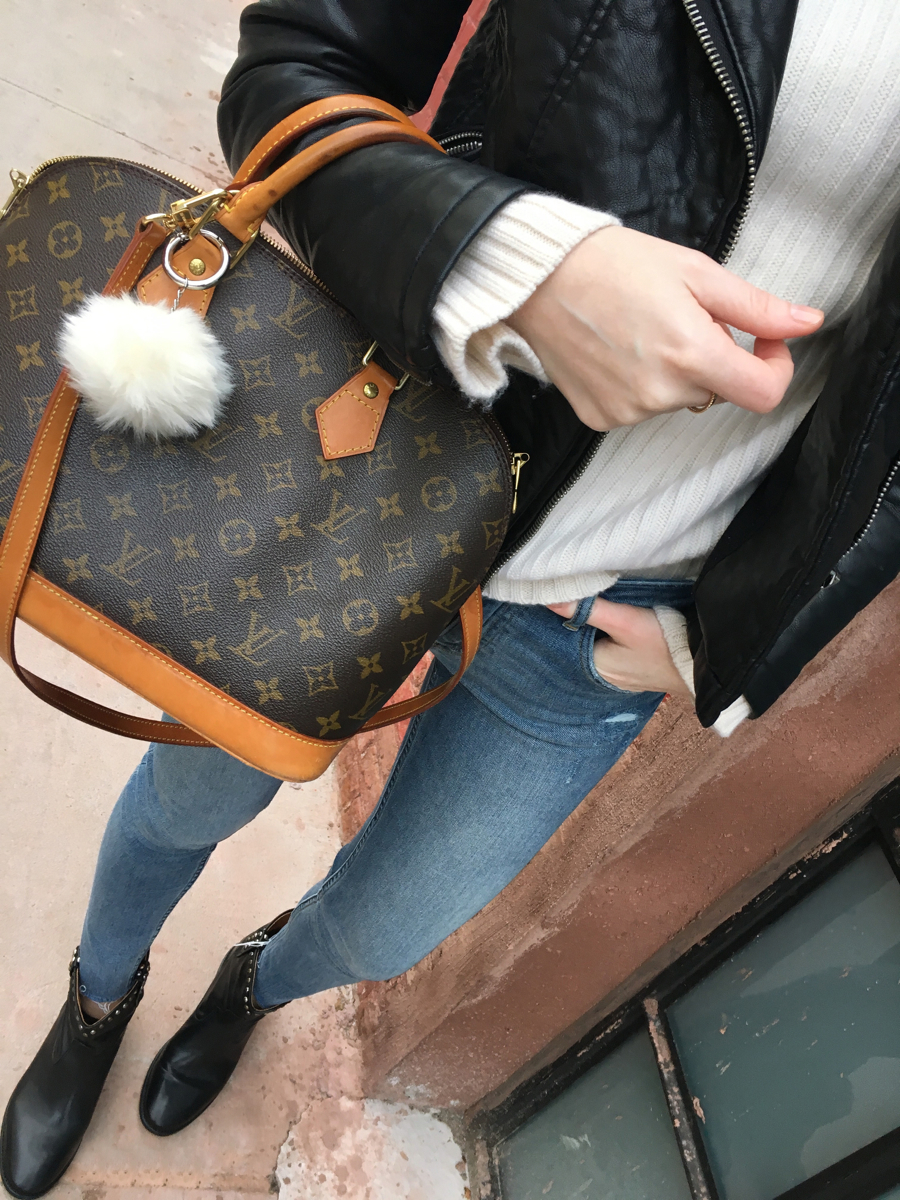 Detail shot of bag and denim jeans