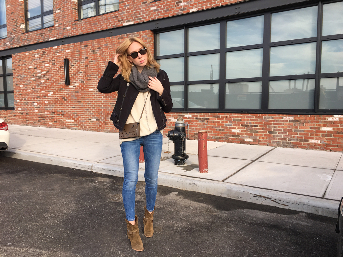 Woman posing with hand on head in street