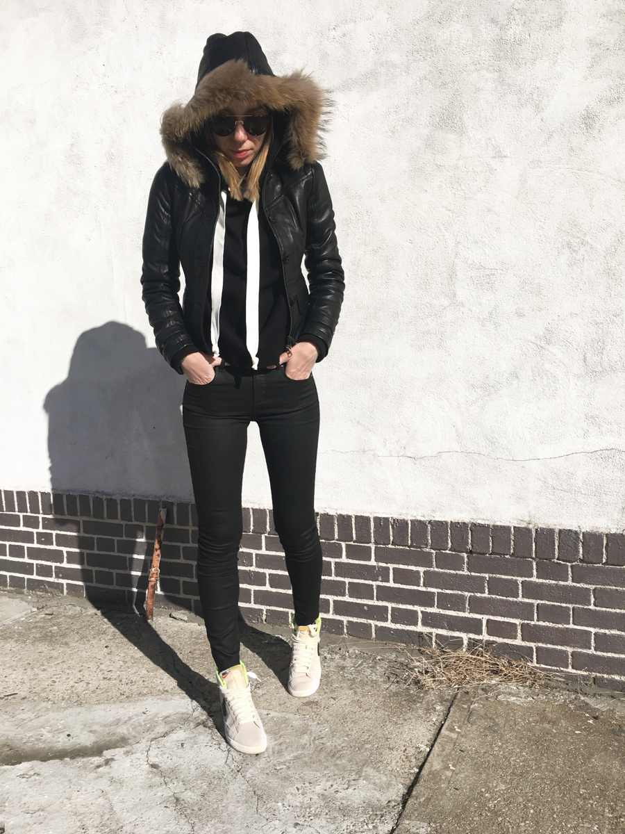 Woman posing in all black outfit