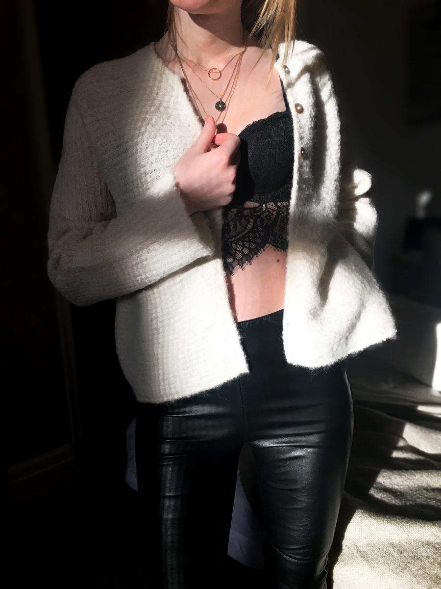 Woman posing in bralette wearing oatmeal cardigan