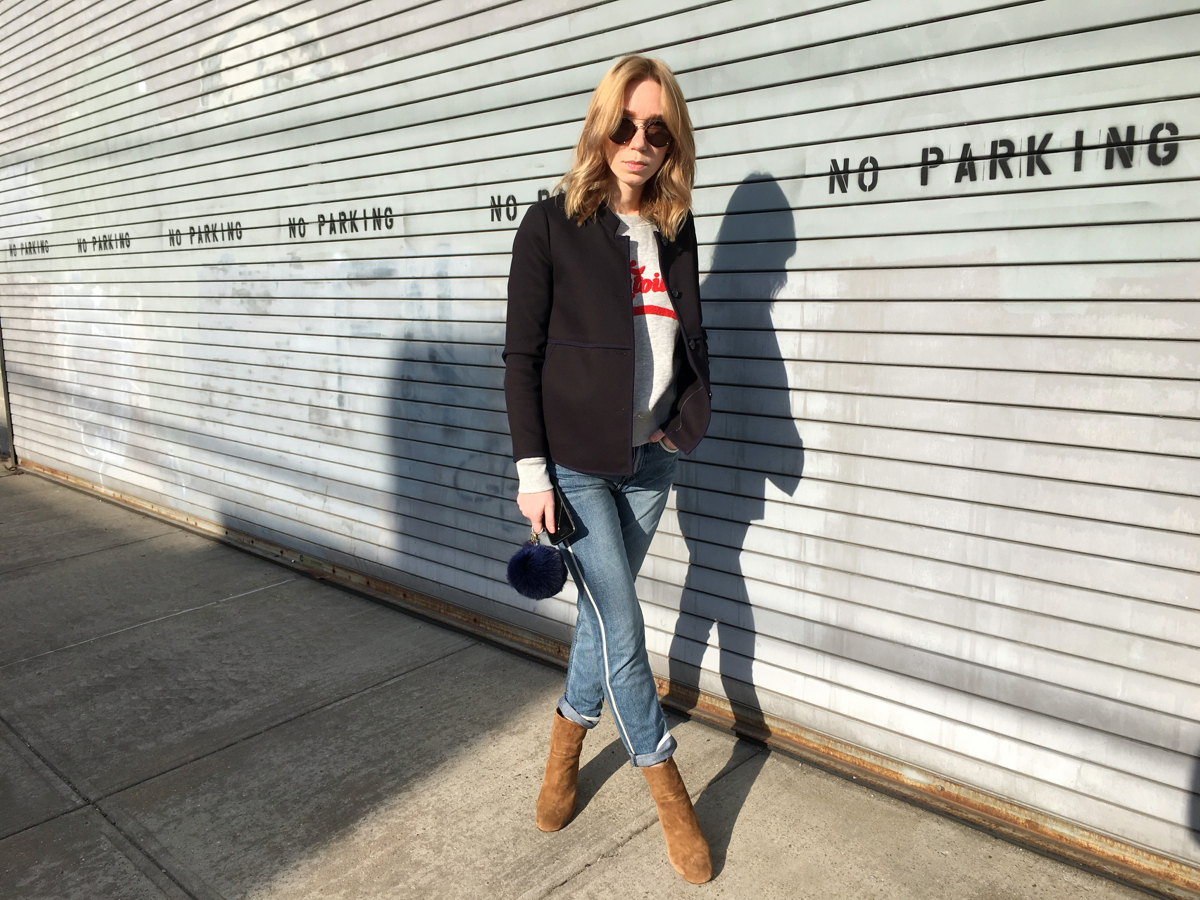 Woman posing in outfit on sidewalk