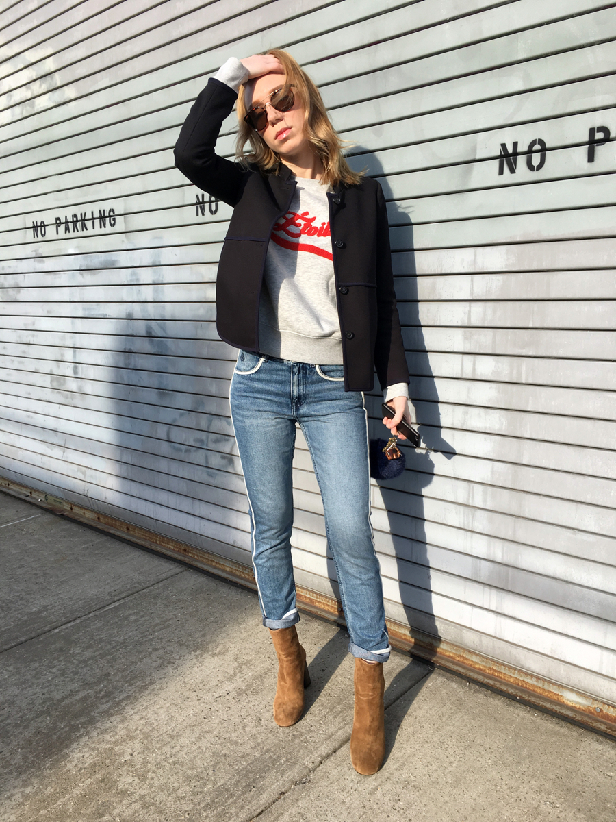 Woman posing in outfit on sidewalk