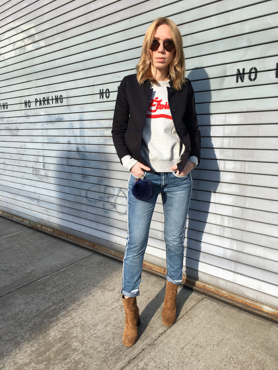 Woman posing in street style outfit 