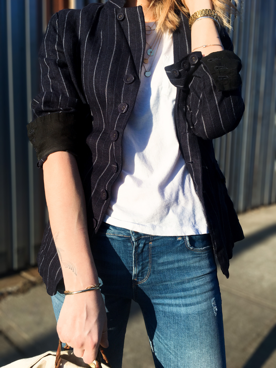 Detail shot of white t shirt with navy linen blazer