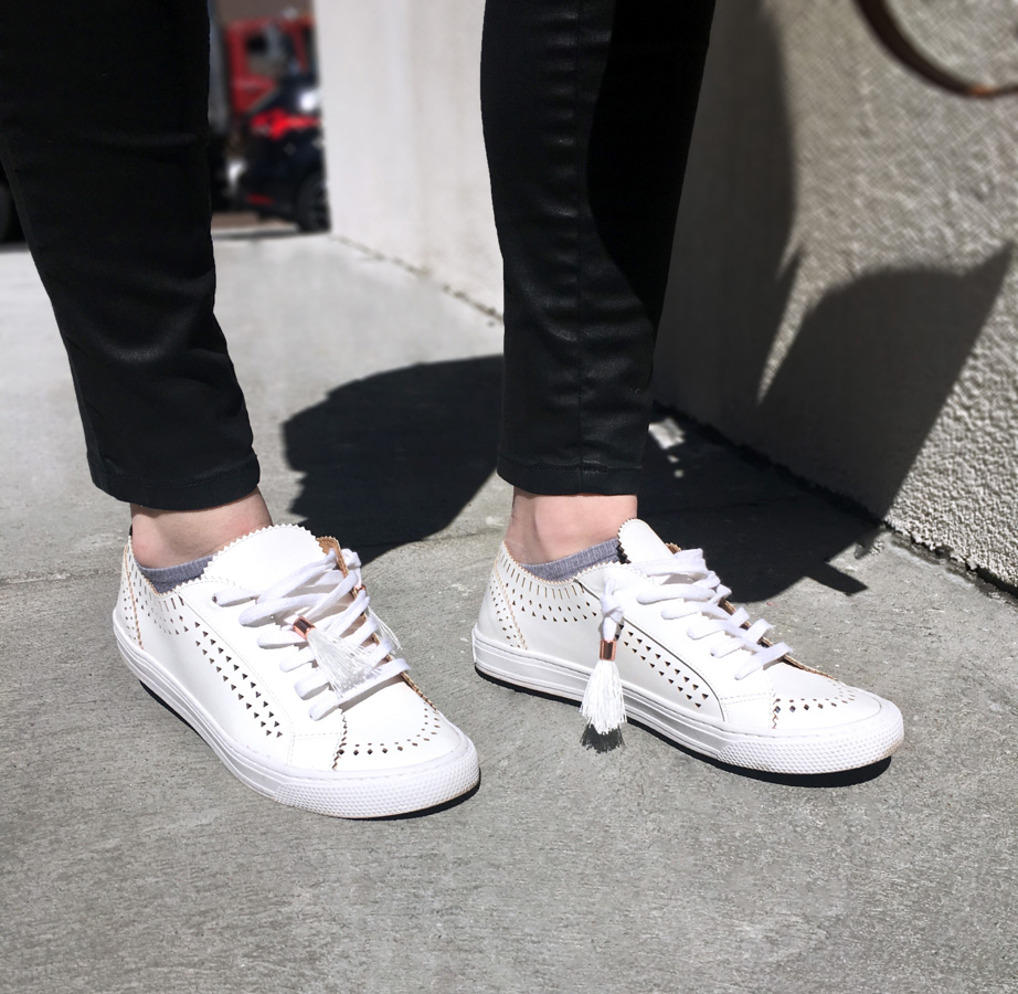 Side detail shot of white sneakers