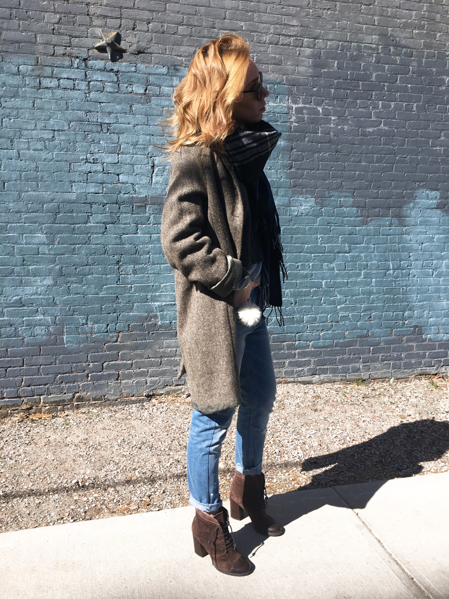 Woman looking sideways posing in outfit