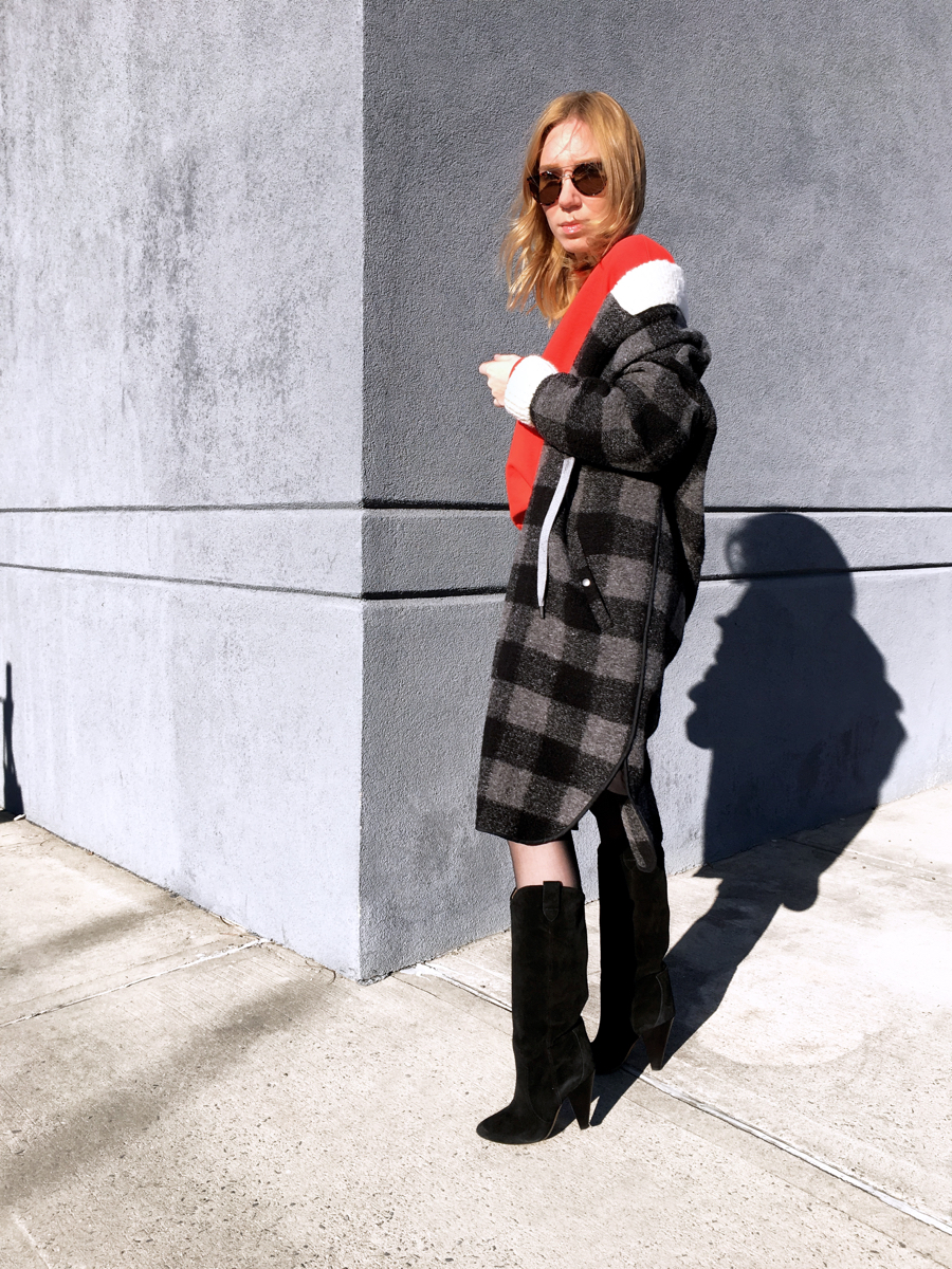 Woman posing sideways in Isabel Marant coat