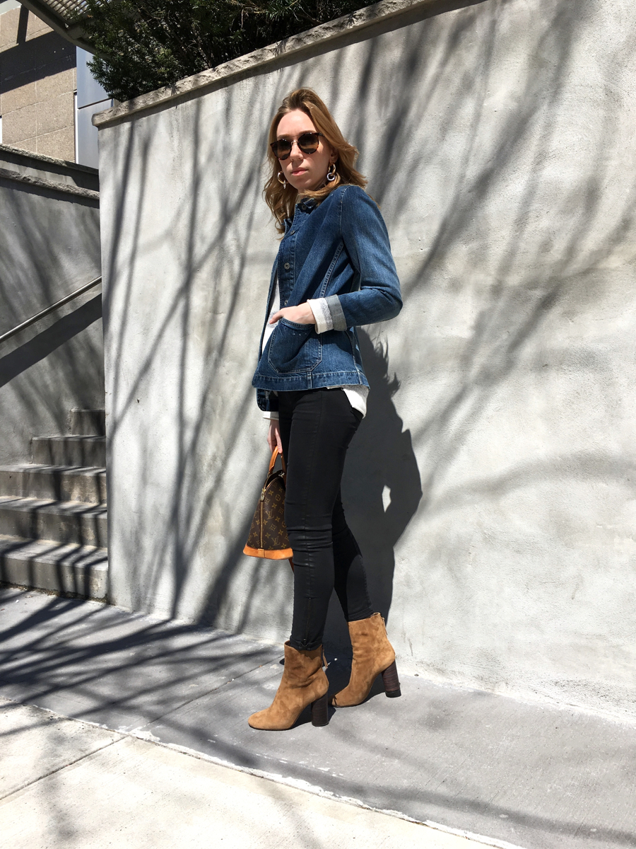 Woman wearing denim jacket with black jeans