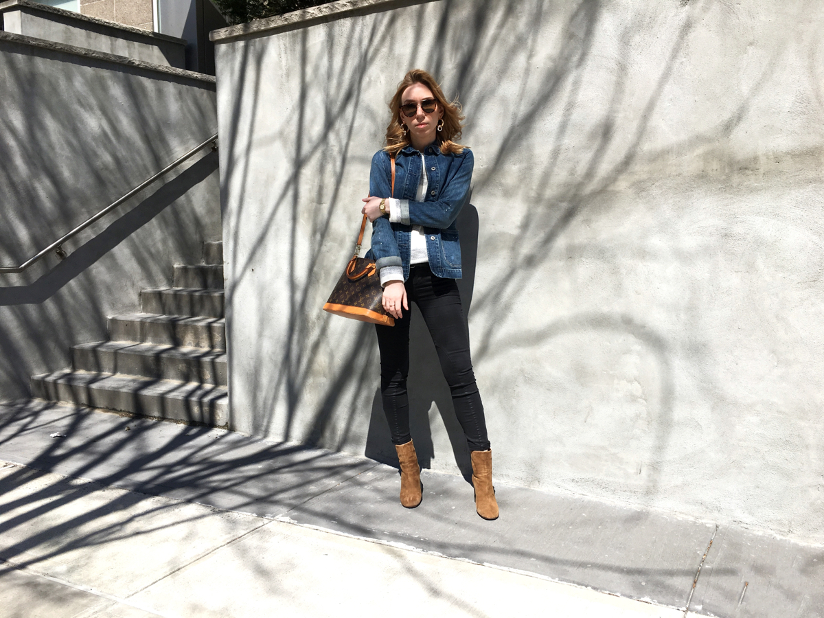 Woman wearing denim outfit posing in street style photo