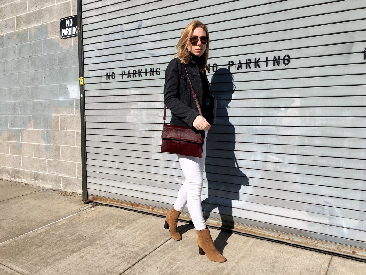 Woman posing in white and grey denim outfit