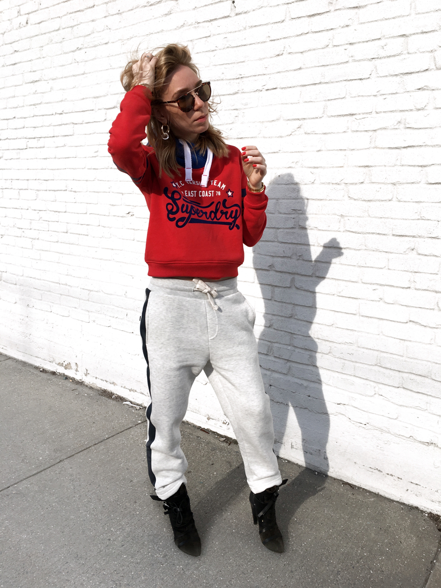 Woman posing in sweats in streetstyle photo