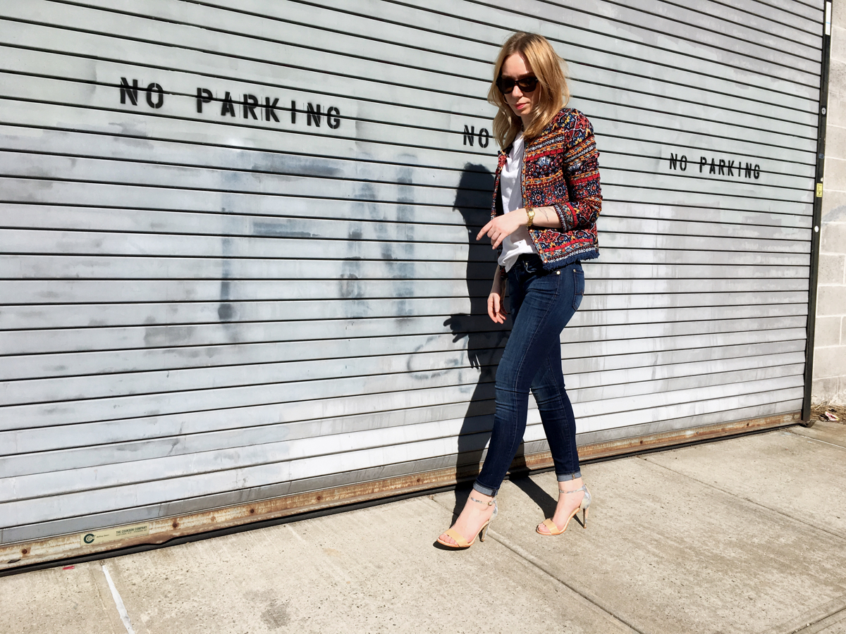 Woman walking in outfit for street style photo