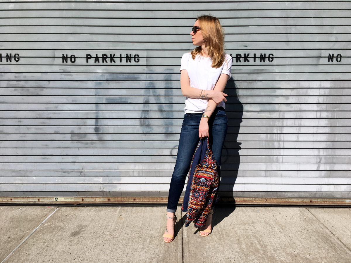 Women holding embellished jacket for style photo