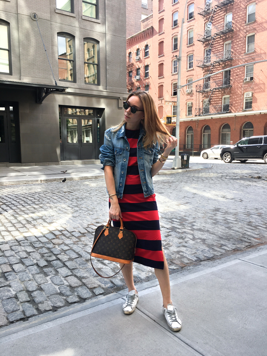 Woman posing on sidewalk 