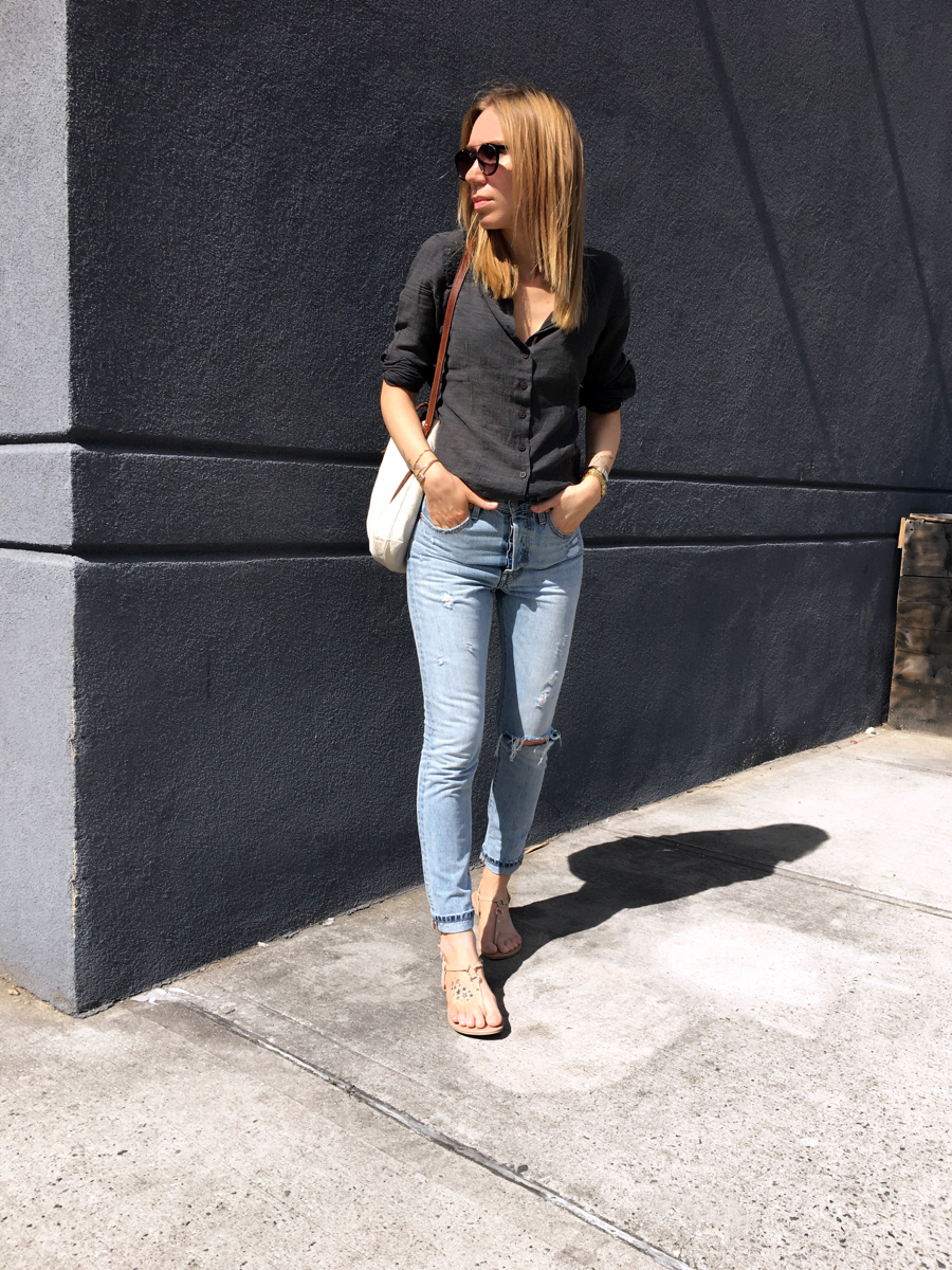 Woman standing for street style photo