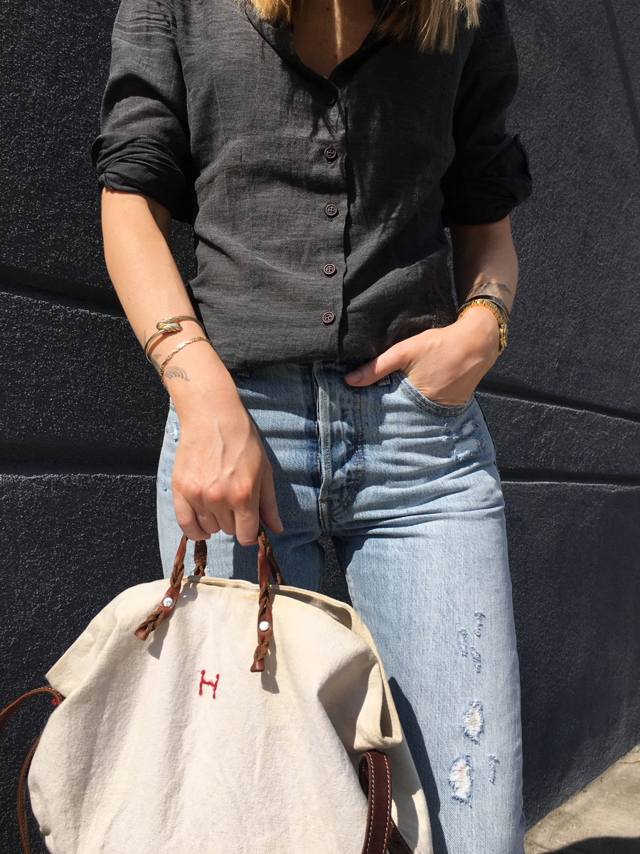 Front detail shot of grey shirt and beige tote