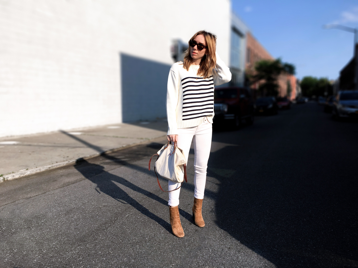 Woman posing in white outfit