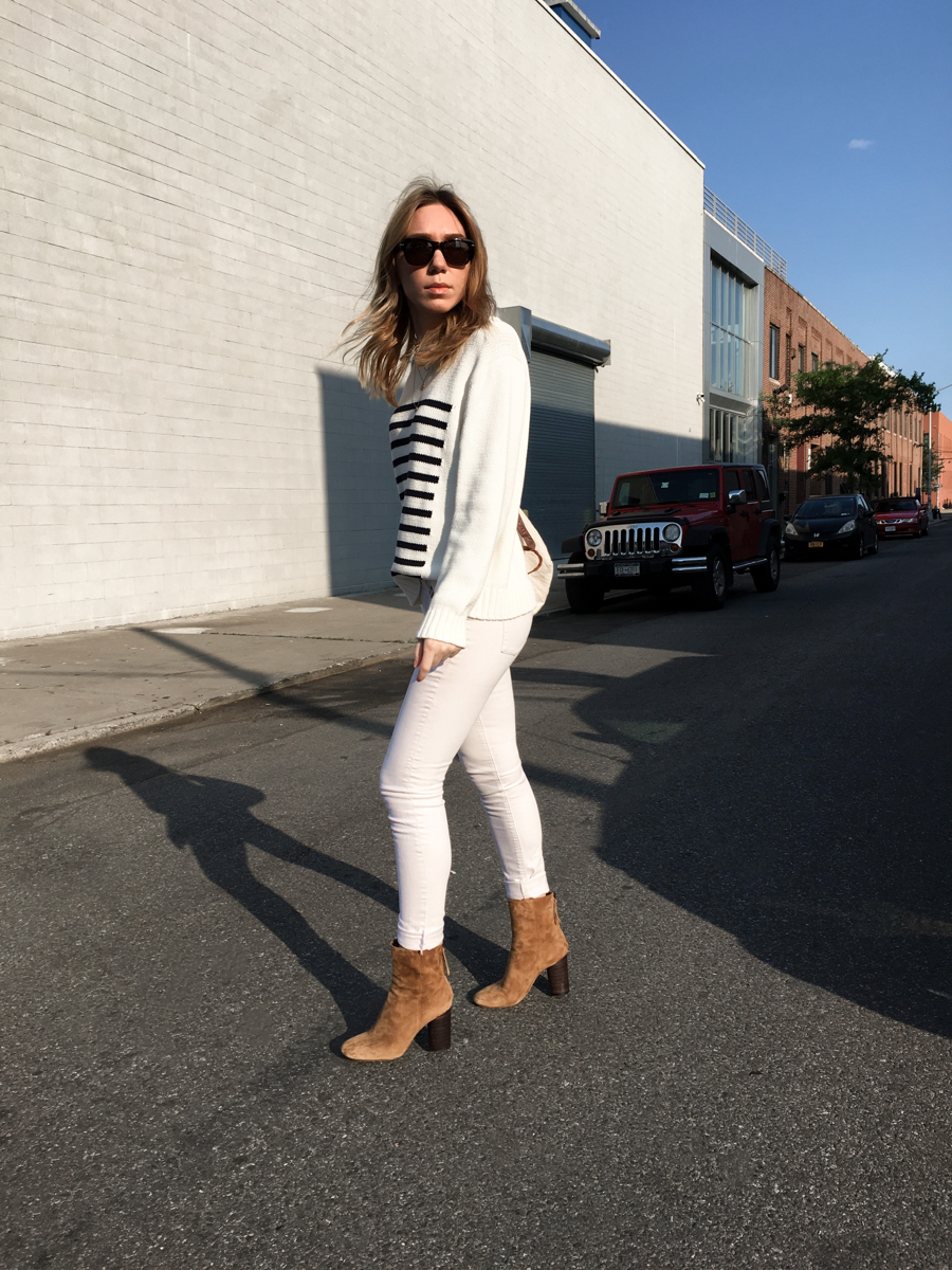 Woman wearing white outfit in street style photo