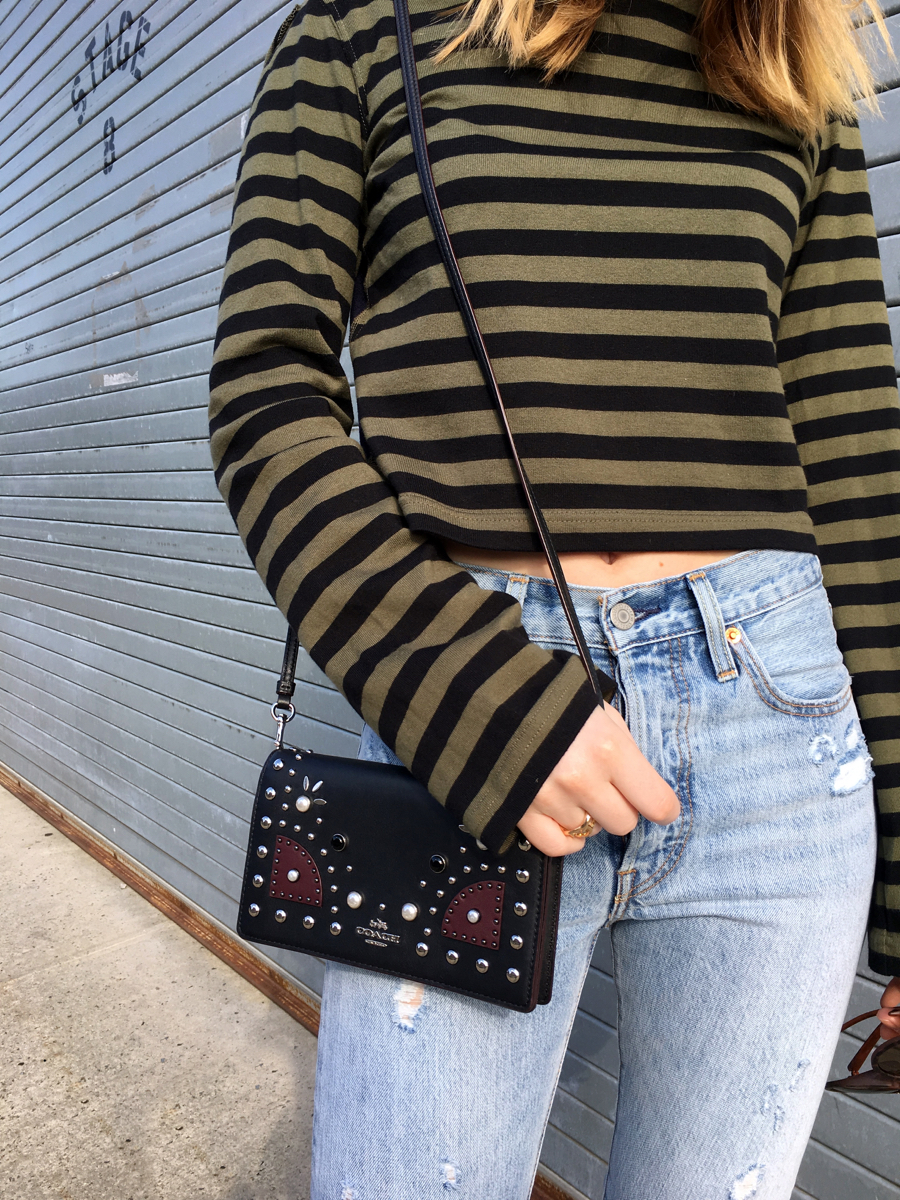 Detail shot of green and navy stripe shirt