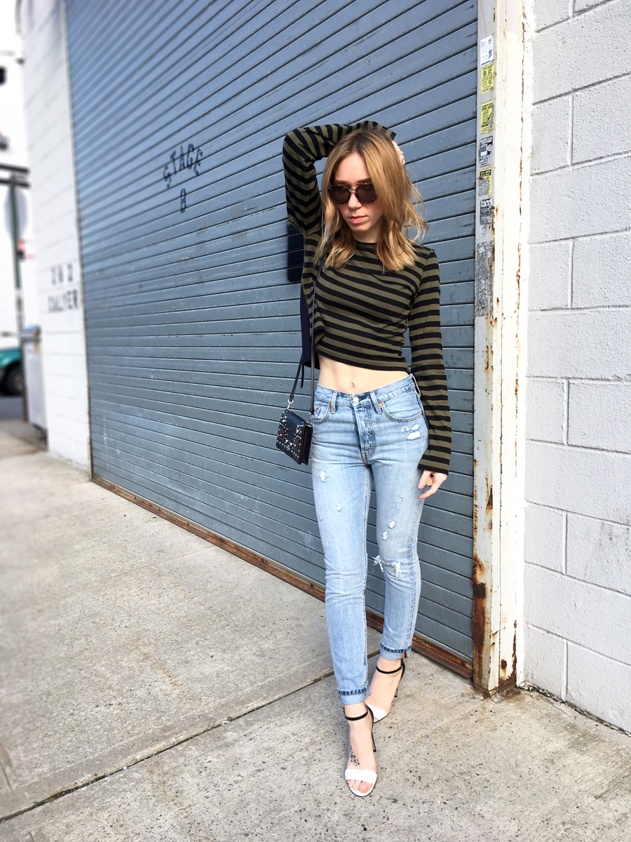 Woman wearing jeans and striped top