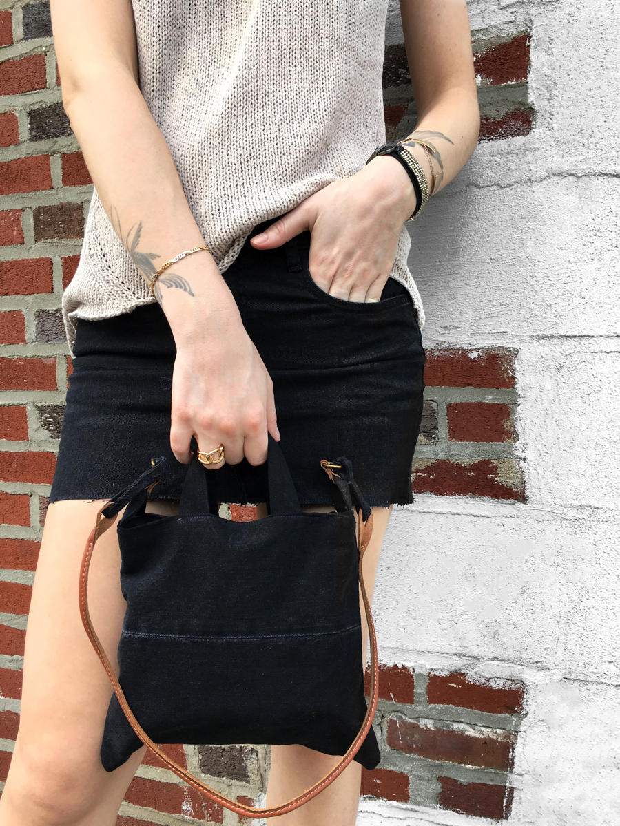 Detail shot of black skirt with bag