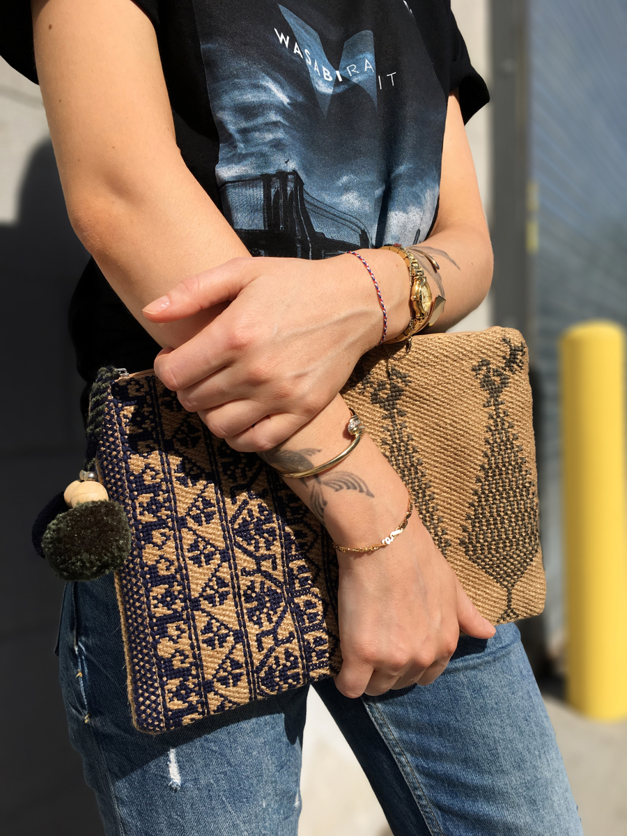 Side detail shot of printed tee and clutch