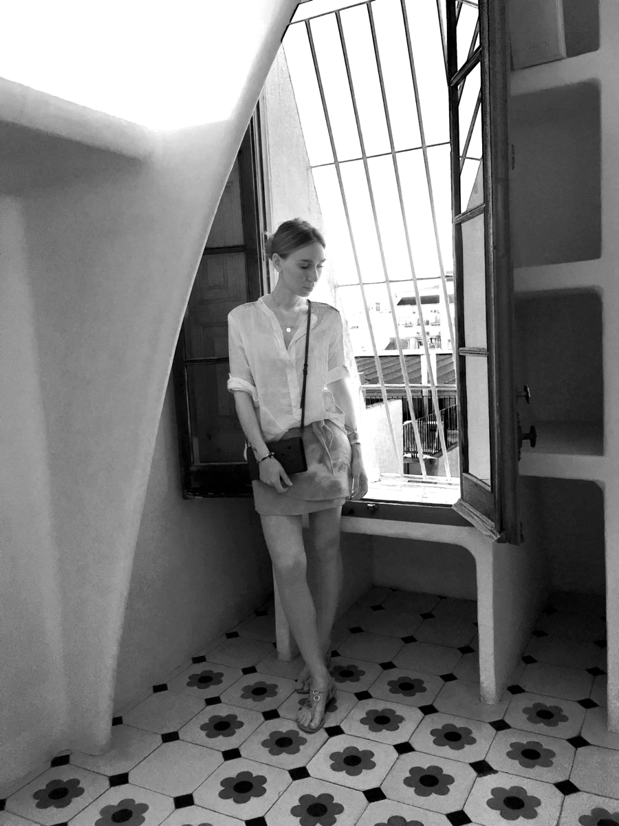 Woman posing near window in Gaudi house