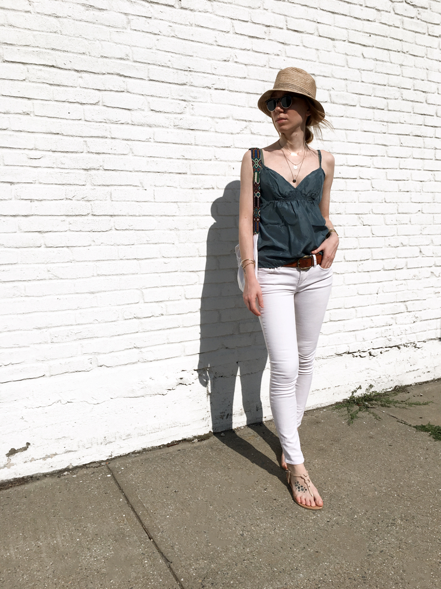 Woman posing in outfit for street style photo