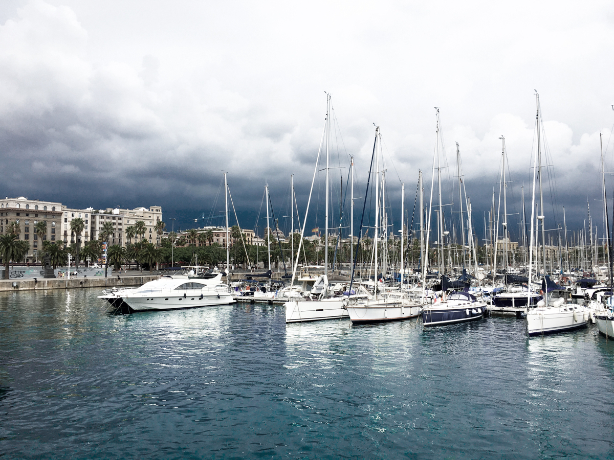Boats docked by a pier in Spain